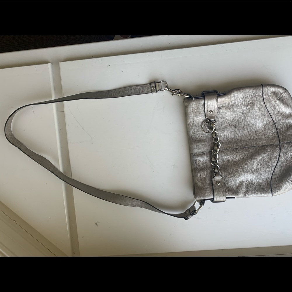Silver coach crossbody purse.